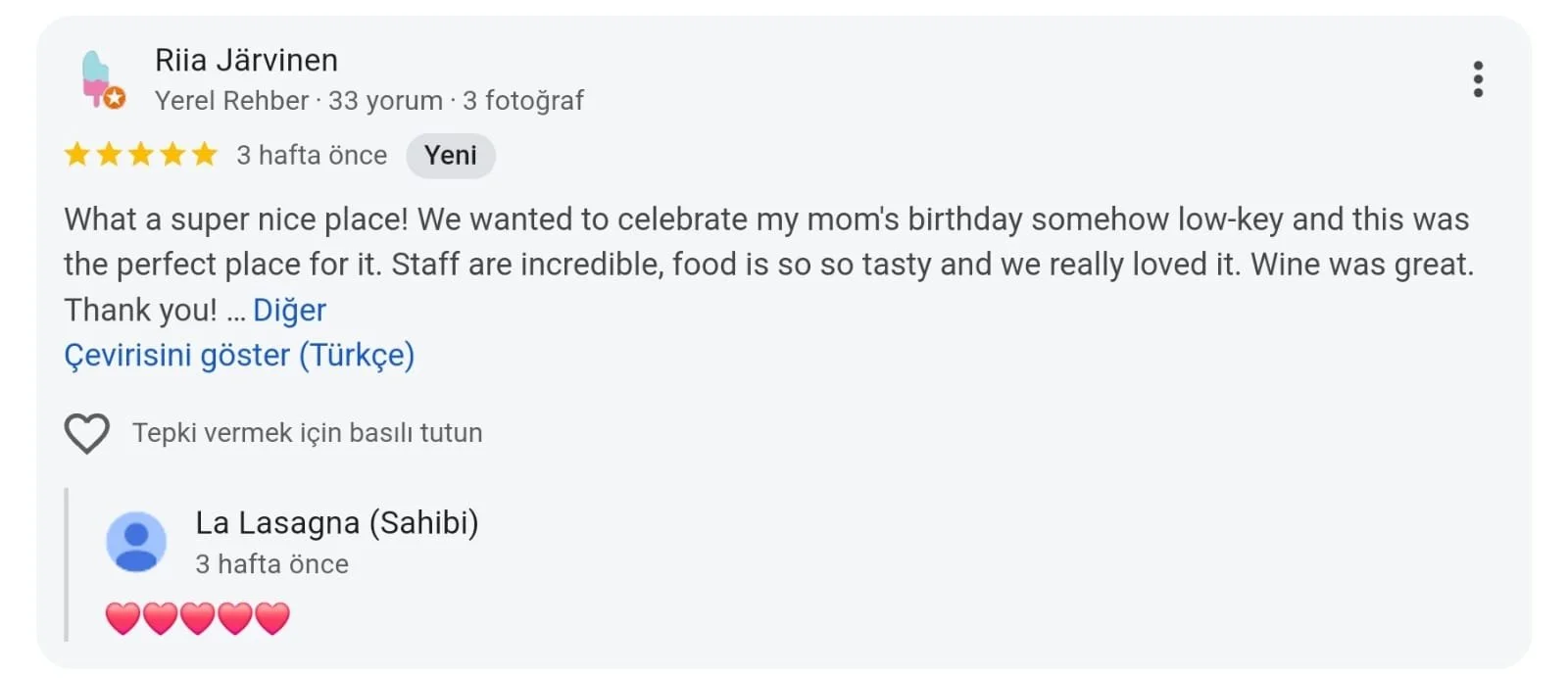 Screenshot of a Google review in Turkish with a 5-star rating for a restaurant, mentioning food, staff, and wine.